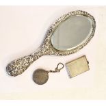Edward VII silver backed hand mirror, Birmingham 1903, a rectangular silver matchbook holder,