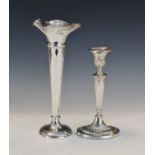 George V silver Neo-classical design candlestick, Chester 1912 and a George V silver spill vase,