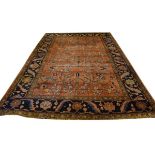 20th Century Middle Eastern carpet having foliate decoration against a red ground with blue