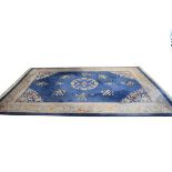 Good quality modern Chinese carpet typically decorated with a central medallion and foliate sprays