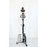 Late 19th/early 20th Century wrought metal and copper decorated telescopic standard lamp, the oil