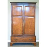 Early 20th Century mahogany wardrobe fitted two panelled doors with drawer below Condition: