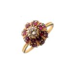 Dress ring set central diamond above a ruby coloured stone mounted globe, size N½ Condition: