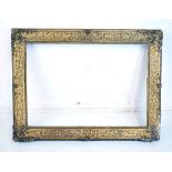 Late 19th/early 20th Century carved gilt gesso rectangular picture frame (aperture 55cm x 81cm)
