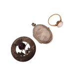 Scottish circular silver brooch set thistle, a silver oval locket and a moonstone set dress ring,