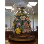 19th/20th Century shell, floral display beneath a glass dome, 43cm tall Condition: