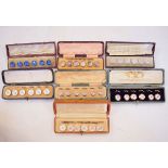 Seven various sets of six dress buttons, all cased Condition: