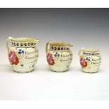 Set of three early 19th Century pearlware graduated documentary jugs, each having polychrome painted