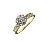 Seven stone diamond cluster ring, 18ct gold mounted, the seven brilliant cuts between shoulders