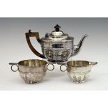 Small Victorian silver three piece tea set having Neo Classical decoration, makers Thomas Slater