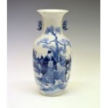 Chinese baluster shaped vase having blue and white painted decoration depicting figures in a garden,