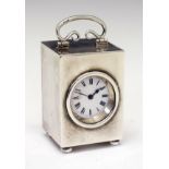 George V silver cased miniature carriage clock, the white enamel dial with Roman numerals, handle to