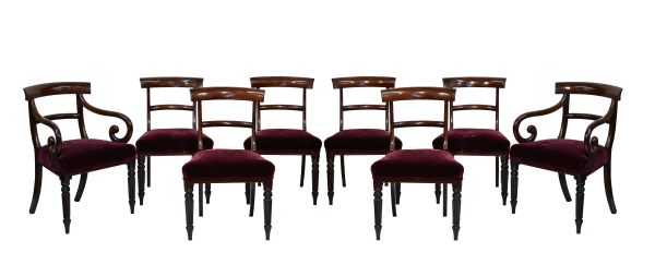 Set of eight William IV mahogany yoke back dining chairs, the seats upholstered in deep red plush