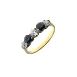 Five stone diamond and sapphire ring, stamped '22', the two oval cut sapphires with three old cut