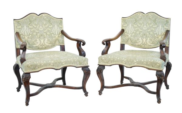 Pair of late 19th Century Continental carved beech and walnut open arm elbow chairs, possibly