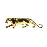 Cartier - Gold panther brooch, in a stalking pose, emerald set eyes, enamel nose, French control