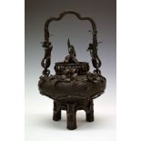 Japanese bronze jar and cover, Meiji period, having a high loop handle, allover foliate decoration