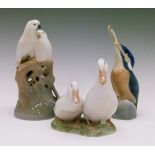 Three Royal Copenhagen bird figures - Parrots On Branches No.649 19cm high, Drake And Duck No.2128