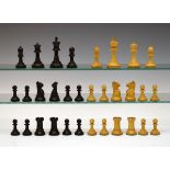 Jaques & Son boxwood and ebonised Staunton chess set, the white king with makers stamp, height of
