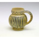 Arthur Barlow for Doulton Lambeth - Stoneware tankard of bulbous form having fluted blue painted