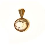 Oval native cut yellow sapphire, in a yellow metal pendant mount with indistinct marks, 1.7g gross