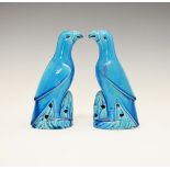 Pair of Chinese turquoise glazed figures of parrots, each perched on a rock, 23cm high Condition: No