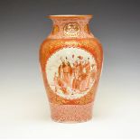Kutani baluster vase decorated with three reserves, each depicting figures in a landscape on a