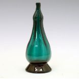 Early 19th Century green glass toddy lifter, possibly Bristol, being of baluster form and standing