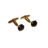 Pair of amethyst cufflinks, stamped '585', 10.1g gross Condition: 11mm x 9mm each, no chips to the