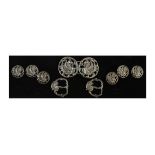 Edward VII silver button and buckle set, each piece with Gryphon decoration, comprising: a two-piece