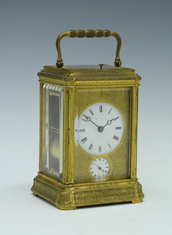 19th Century engraved brass gorge cased repeat carriage clock, the white enamel dial with Roman