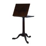 George III mahogany reading table having an adjustable rectangular top, standing on a tapered