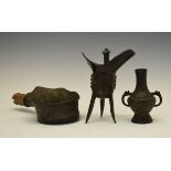 Chinese bronze silk iron, 14cm diameter, a bronze tripod ritual wine vessel, 19cm high and a