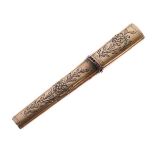 Early 19th Century foliate engraved gold coloured metal needle case inset with red stones, 8.25cm