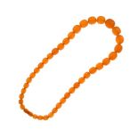 Graduated row of oval amber beads, the thirty-nine beads to an amber screw barrel clasp, 60cm