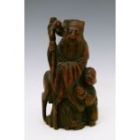 Chinese carved wooden figure depicting Fuxing with a child and crane, 12.25cm high Condition: