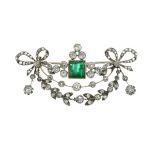 French diamond and emerald pendant brooch, the central stone approximately 6mm square, to a ribbon