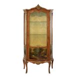 French style walnut vitrine having cast brass mounts, three shelves enclosed by a glazed door,