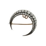 Late Victorian diamond crescent brooch, circa 1890, with a graduated outer row and inner row of