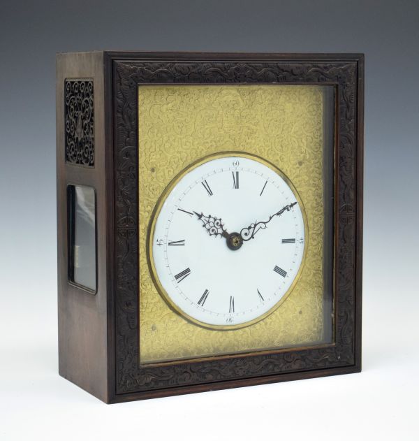 Chinese hardwood cased table clock, the case with glazed and fret carved side panels, sliding