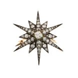 Late Victorian diamond starburst brooch, circa 1890, the central silver collet set old brilliant cut