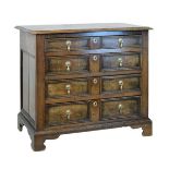 18th Century oak chest of four long drawers having moulded decoration and standing on bracket