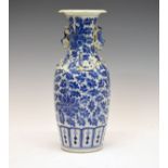 Chinese baluster shaped vase having allover blue and white painted foliate scroll decoration,