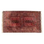 Modern Middle Eastern style red ground rug having allover geometric decoration within multi borders,