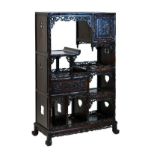 Late 19th/early 20th Century Chinese carved hardwood display stand fitted open shelves, cupboard