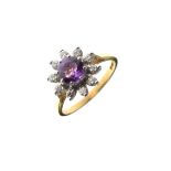 18ct gold diamond daisy cluster ring having purple coloured central stone, size L Condition: