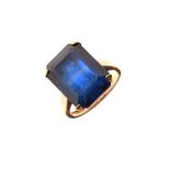9ct gold dress ring set emerald cut blue coloured stone, size L Condition:
