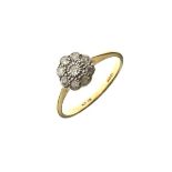 Diamond set daisy cluster ring, the shank stamped 18ct and Plat, size O Condition: