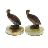 Pair of cold painted bronze figural menu holders, each formed as a grouse and on a circular green