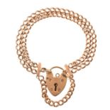 9ct gold twin curb link bracelet having heart shaped clasp Condition: